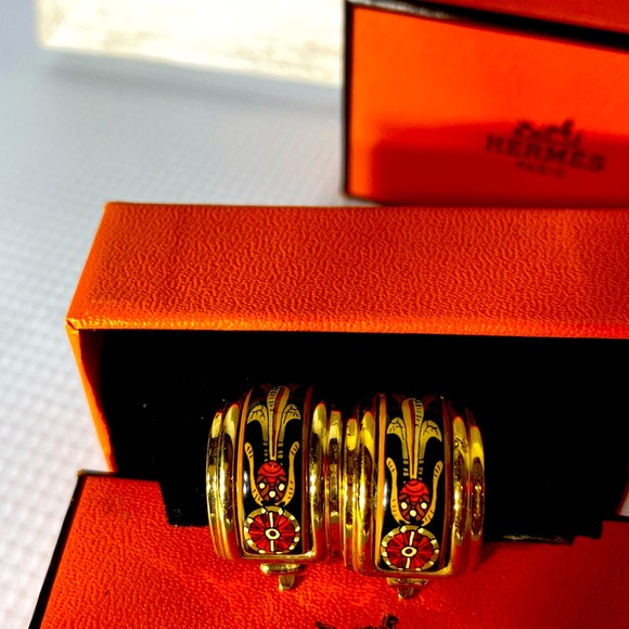 Hermes clip on earrings one blue and one red chose one